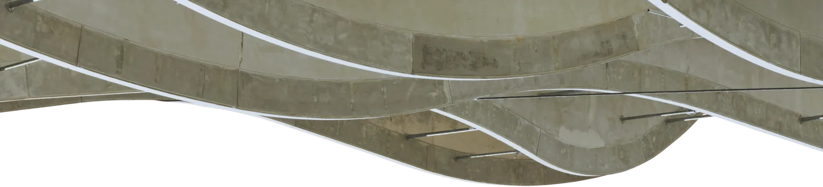 Curved architectural canopy with layered concrete waves